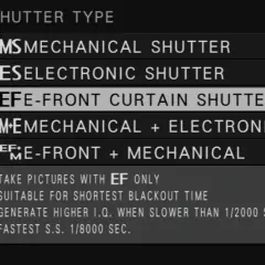 Menu aparatu z opcjami migawki. Wybrana opcja to "EF E-FRONT CURTAIN SHUTTER", która zapewnia najlepszą jakość obrazu (I.Q.) przy krótkich czasach naświetlania.