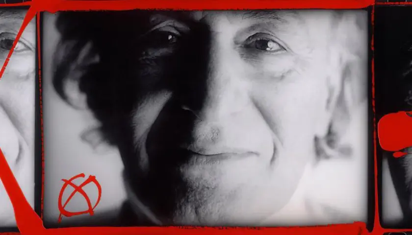 Portret mężczyzny z charakterystycznym symbolem anarchii, w stylu **William Klein**. Czerwone pociągnięcia farby dodają dynamiki.